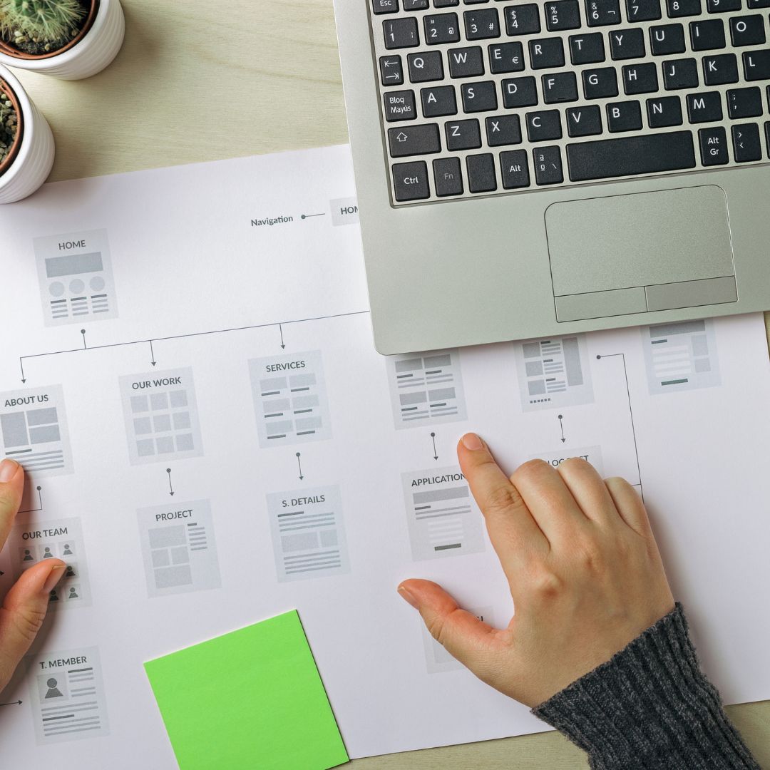 Person Working on Website Conversion Plan. Laptop, Notepad, Plants. Why Your Website Isn't Converting And How To Fix It. Three Common Problems and Five Easy Fixes. UX. UX Design. Website Design. Website Conversions. Conversion Optimisation. Conversion Optimisation Plan.